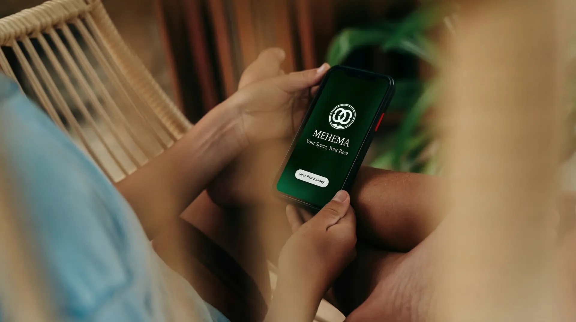 Person using Mehema app on phone