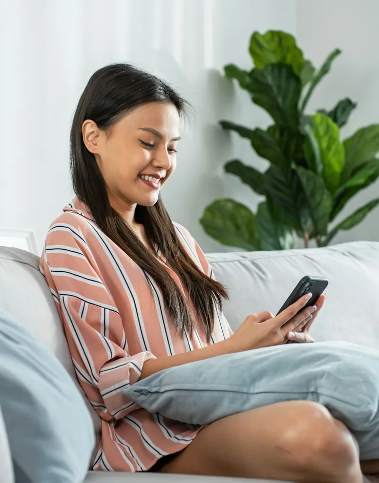 Young woman on phone smiling